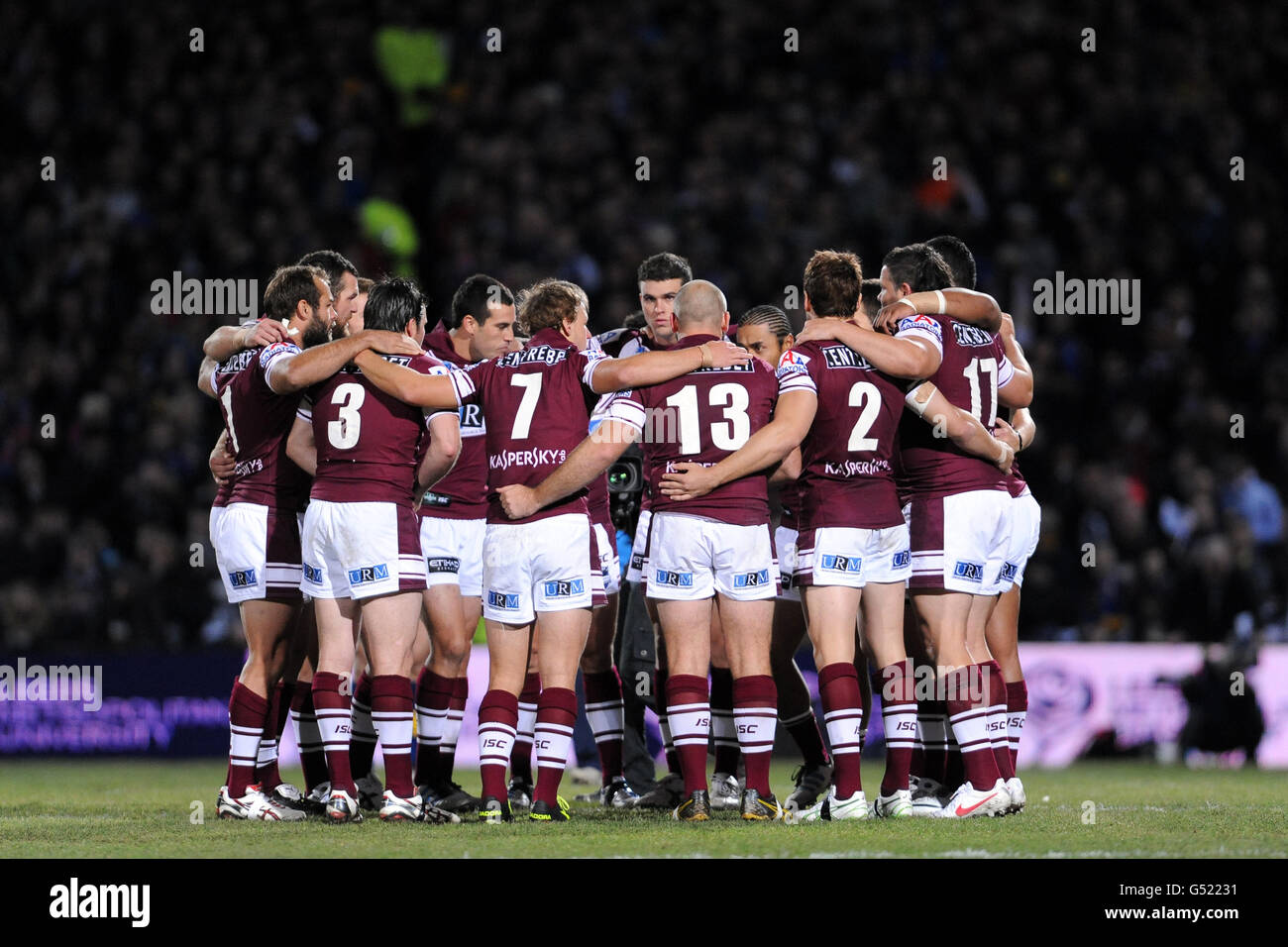 The Manly Sea Eagles team huddle together before the game Stock Photo
