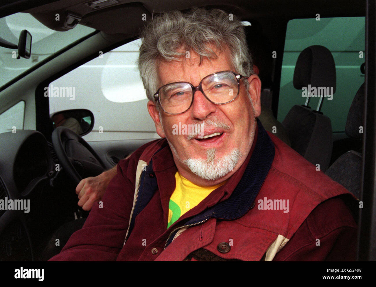 Smiling celebrity glasses glasses white beard goatee car rolf harris hi