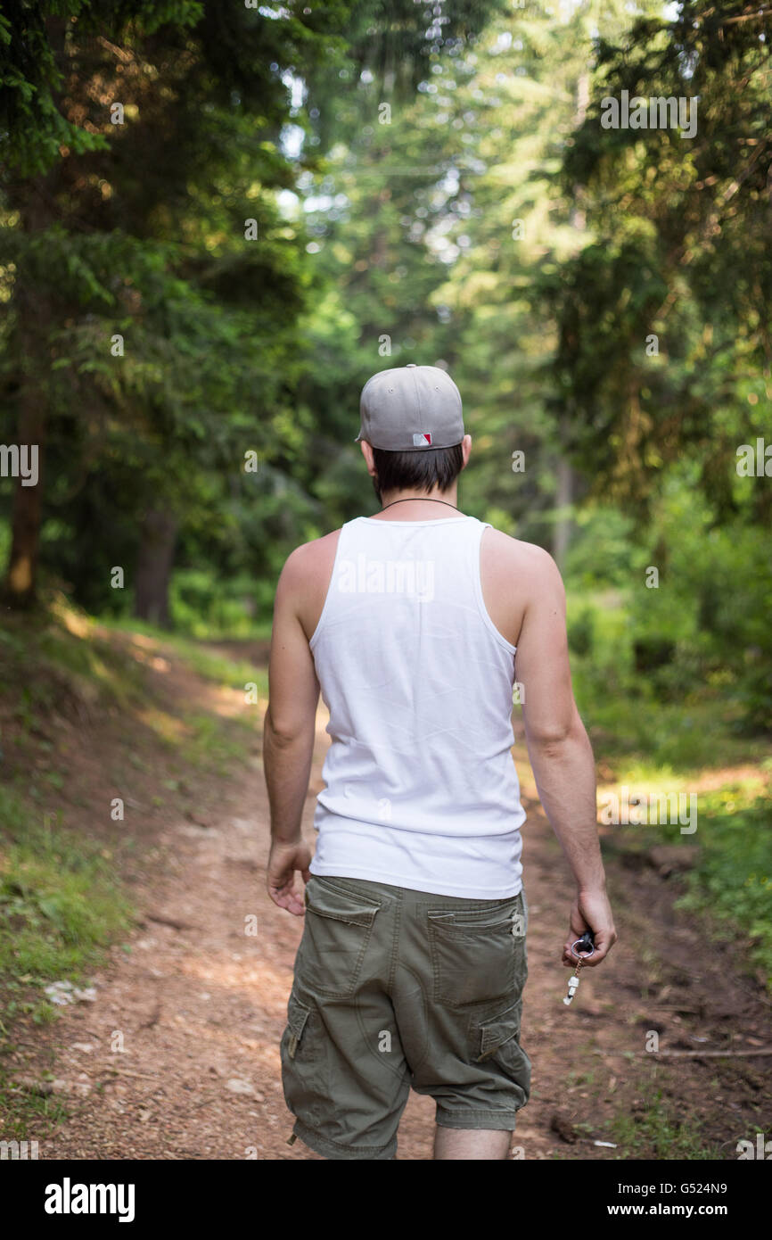 Young man walking through hi-res stock photography and images - Alamy
