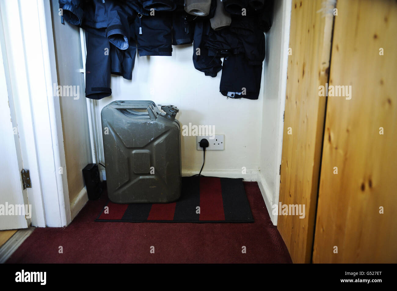 A general view of metal jerry can containing fuel stored inside a home in Bristol, after sales of petrol and diesel increased dramatically yesterday as motorists flocked to garages to fill up following controversial advice from the Government ahead of a possible strike by fuel tanker drivers. Stock Photo