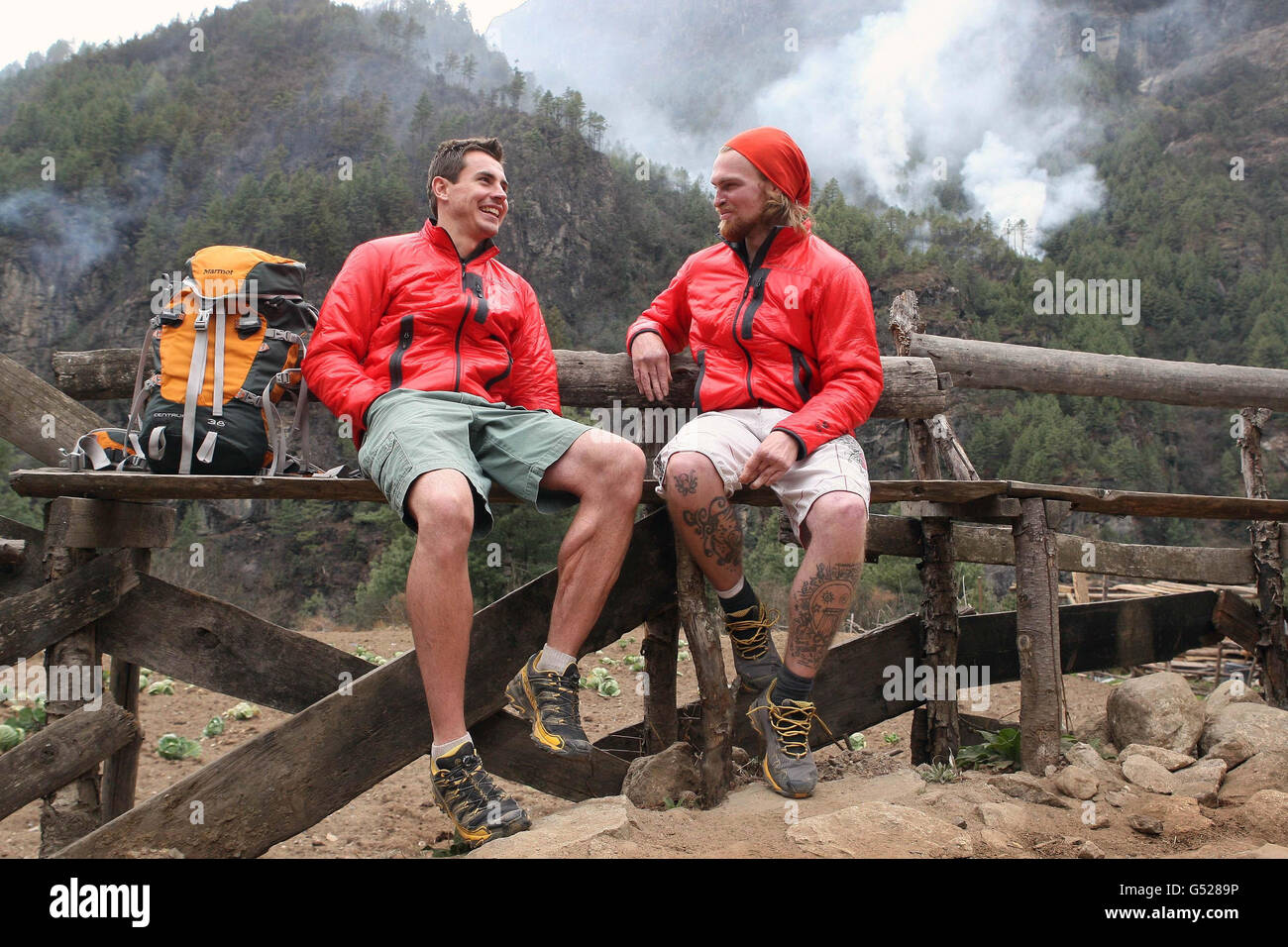 The Walking with the Wounded team members Private Jaco van Gass from South Africa (left) stops for a chat with Karl Hinett from Tipton, West Midlands as they arrive near Monjo on the first day of their ten day trek to Everest. Stock Photo