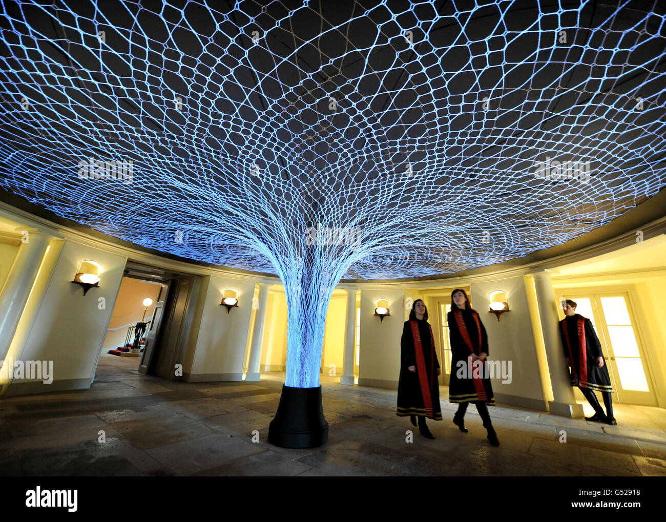 Actors in costume look at Luminous Lace, a light sculpture by designers  Loop.pH during the press preview at Kensington Palace, London, which has  undergone a £12m refurbishment as part of the Queen's