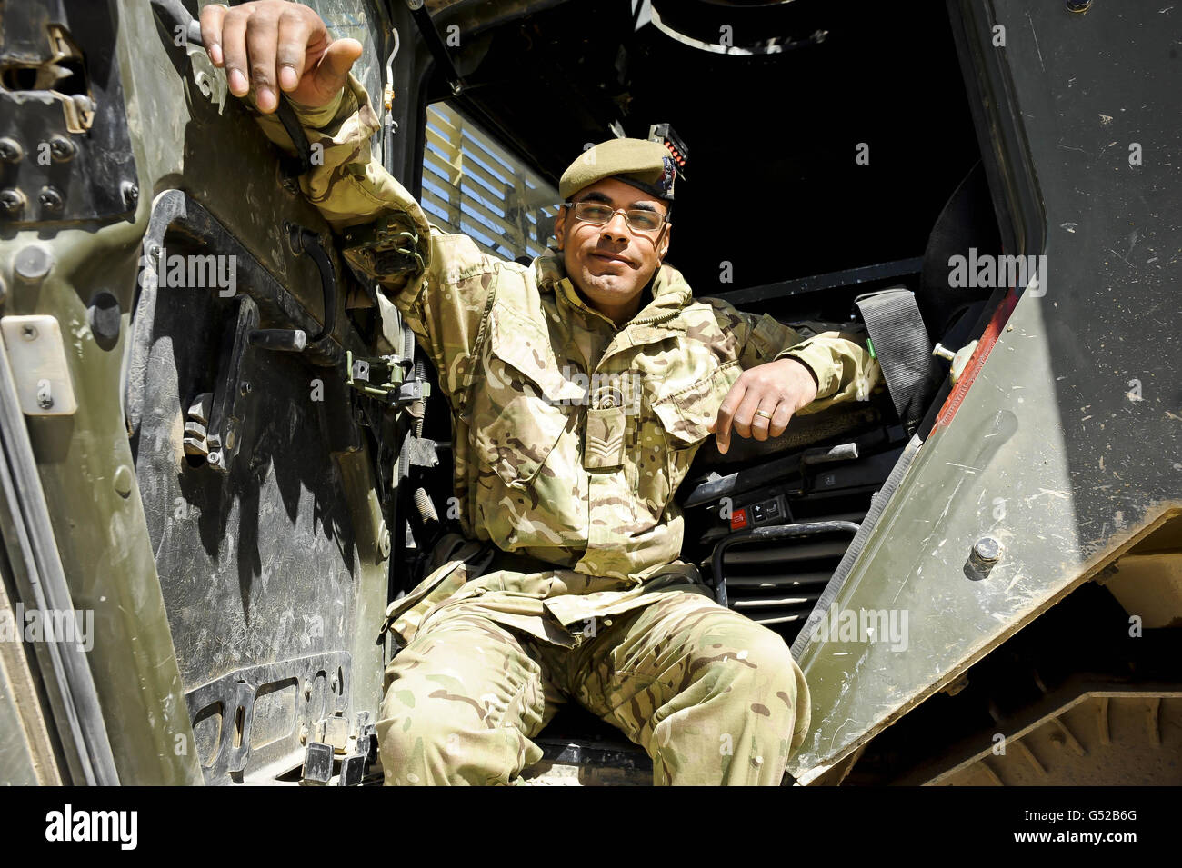 Sergeant Mark James, 31, from Stafford, of 1st Battalion Grenadier Guards sits beside the commanders seat of his EPLS ISO movements vehicle, where he was sat when caught in an IED blast in the Nar-E-Saraj district of Helmand Province, Afghanistan. Sargeant James and his driver survived the blast on the same day six soldiers were repatriated to the UK after being killed in an IED blast not more than 10 Kilometers away from where the Warrior vehicle was hit. Stock Photo