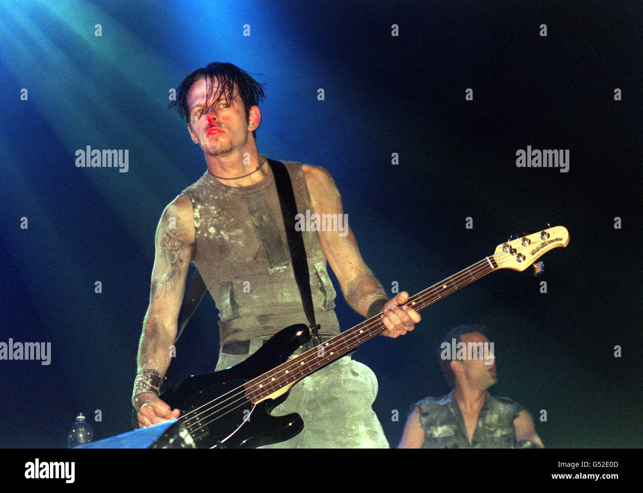 The bass player with American Industrial rock band Nine Inch Nails  performing on stage at the Glastonbury Music Festival 2000 in Pilton,  Somerset Stock Photo - Alamy