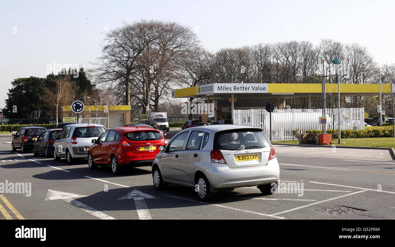 People queue to buy petrol at Morrisons petrol station in Belle Vale