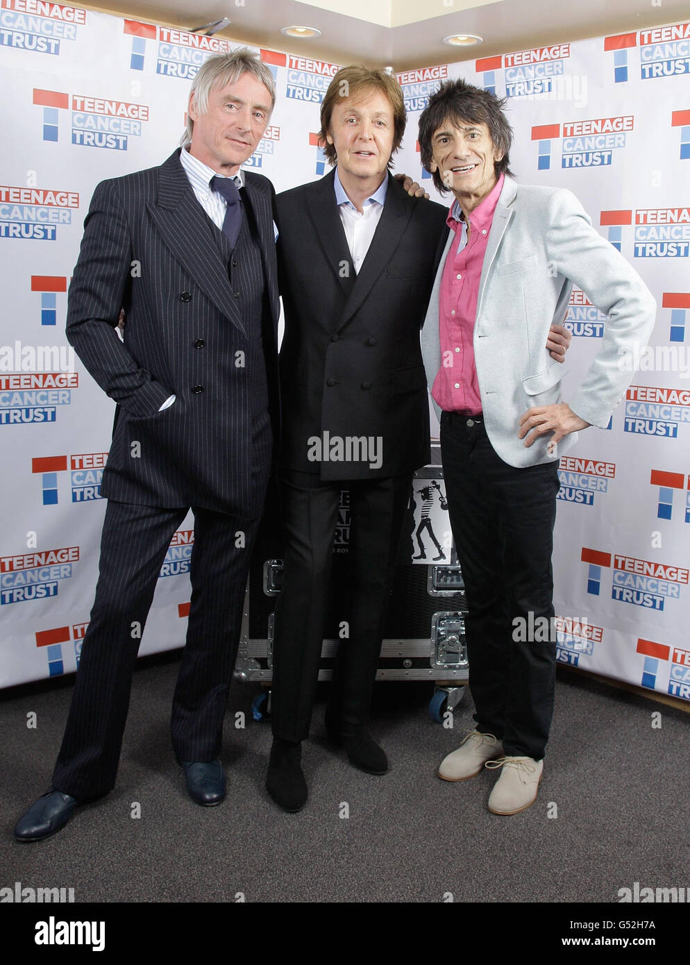 (Lef - right) Paul Weller, Sir Paul McCartney and Ronnie Wood backstage at a Teenage Cancer Trust gig at the Royal Albert Hall, London. Stock Photo