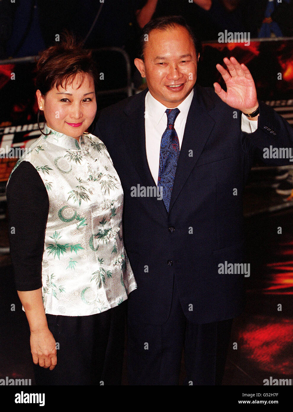 Film director John Woo and his wife arrive for the Gala Premiere of the Mission Impossible sequel, M:I-2, at the Empire cinema Leicester Square, central London. Tom Cruise stars as special agent Ethan Hunt in the romantic action thriller. * derived from the cult TV series from the 1960's. Stock Photo