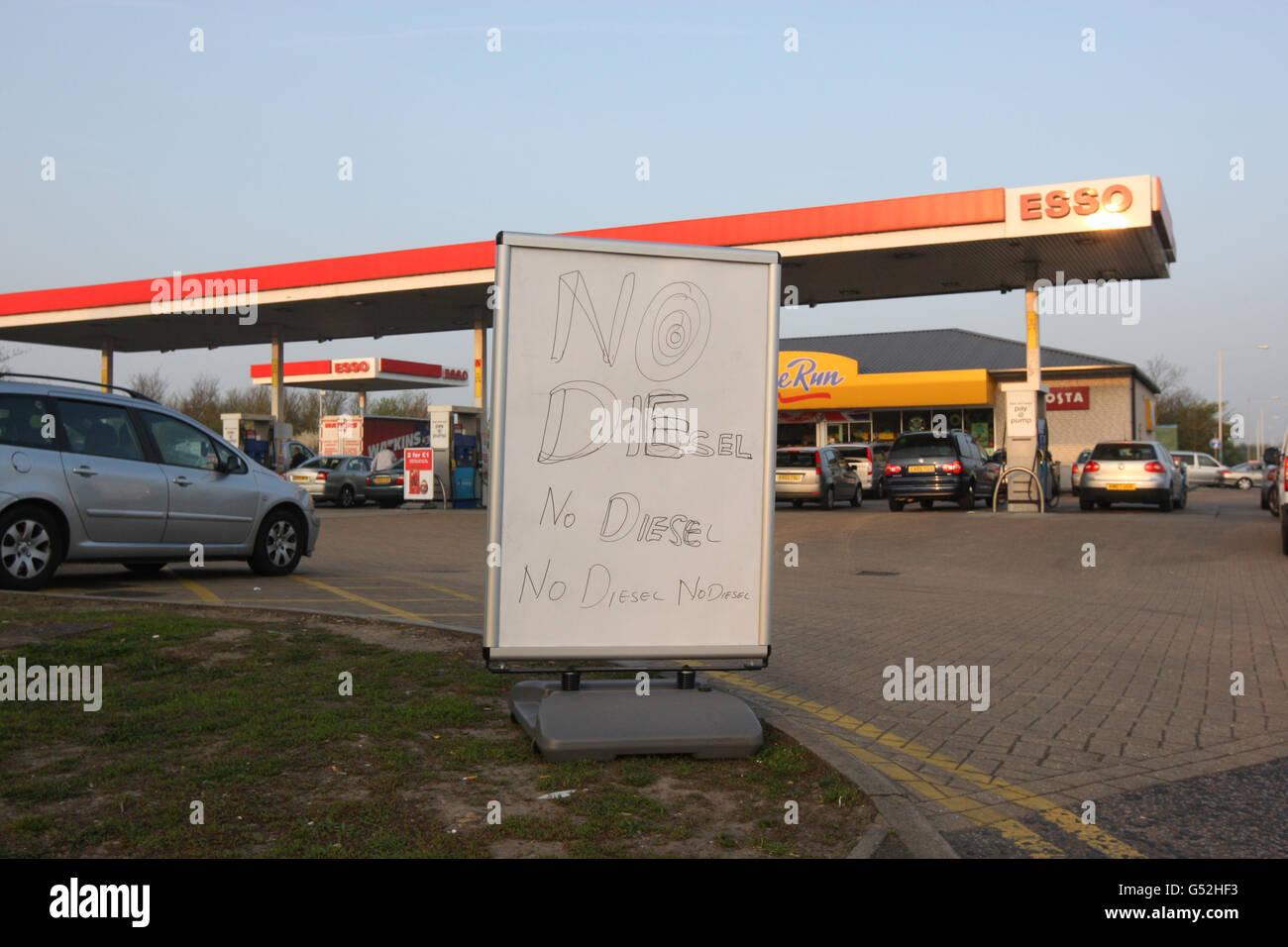 A sign announcing they have sold out of diesel outside the Esso garage at Heathrow Airport, as ministers will discuss emergency plans to deal with a tanker driver strike with haulier bosses today amid continued panic-buying at the pumps. Stock Photo