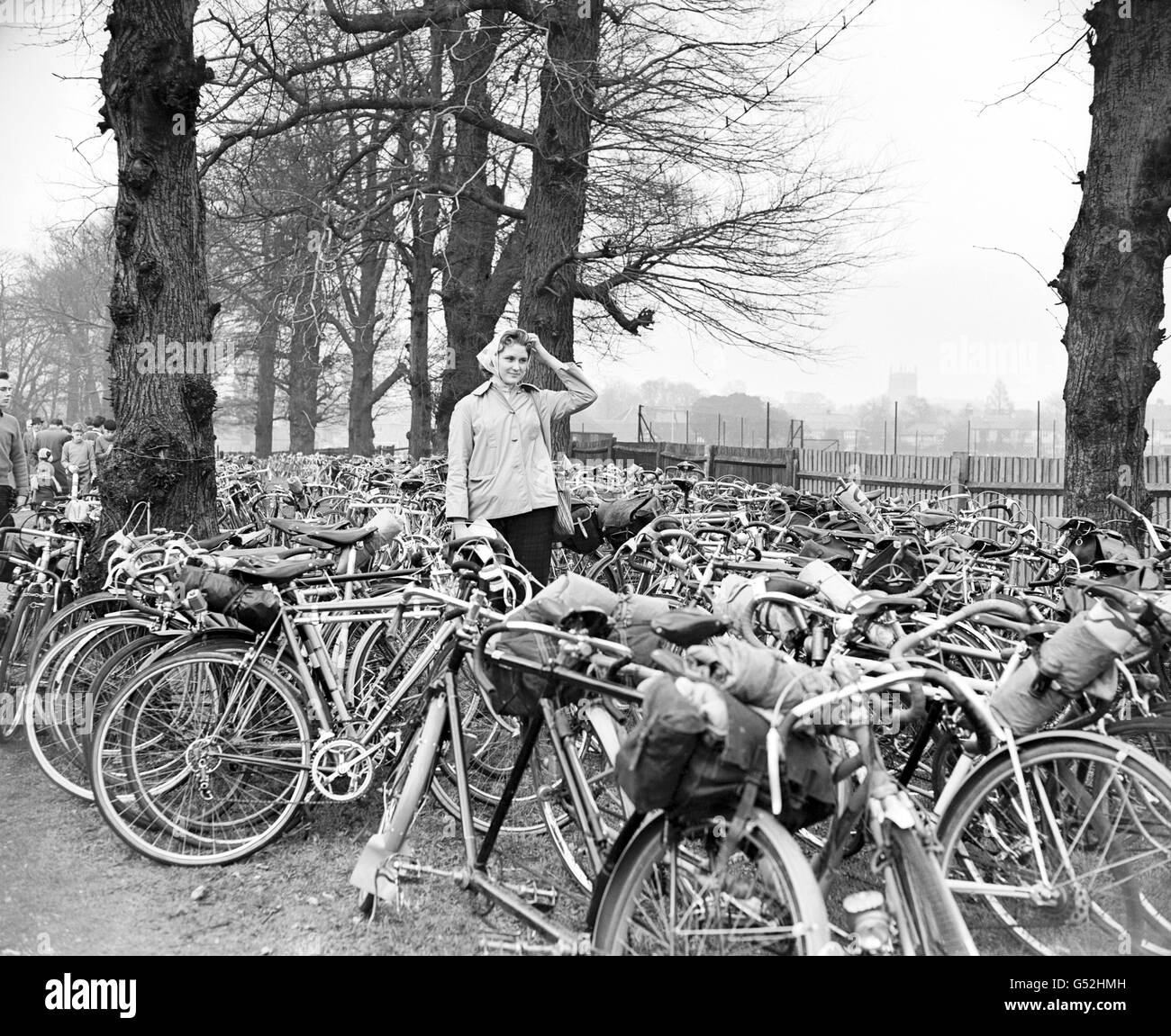 19 year old Valerie Daniels of East Dulwich having difficulty in finding her bicycle amongst the many parked in the cycle park. Stock Photo