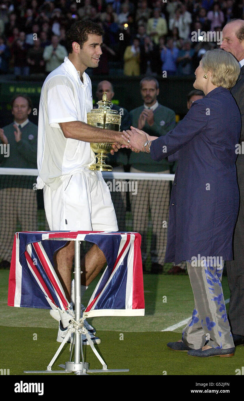 NO COMMERCIAL USE: America's Pete Sampras receives the Men's Singles trophy from HRH Duke & Duchess of Kent after defeating Pat Rafter 6/7 7/6 6/4 6/2 to win the Men's Singles Final at Wimbledon. Stock Photo