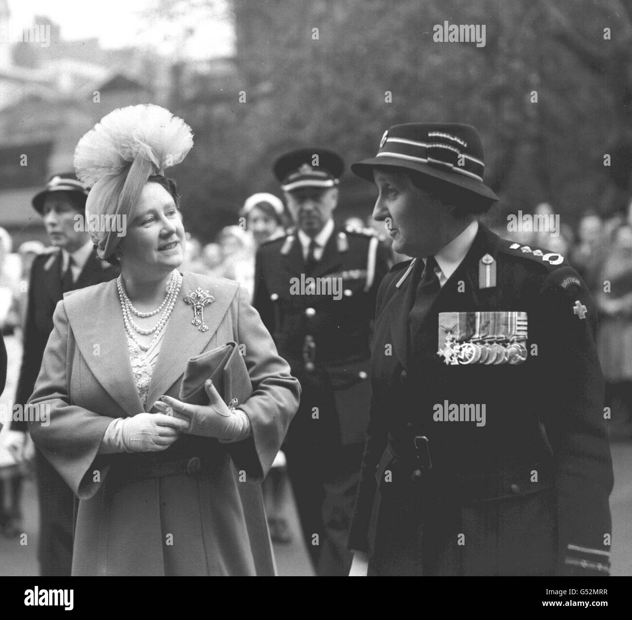 The Queen Mother visited the headquarters of the British Red Cross Society in Grosvenor Crescent, London. The visit was made in connection with the anniversary of Henri Dunant, founder of the society. Stock Photo