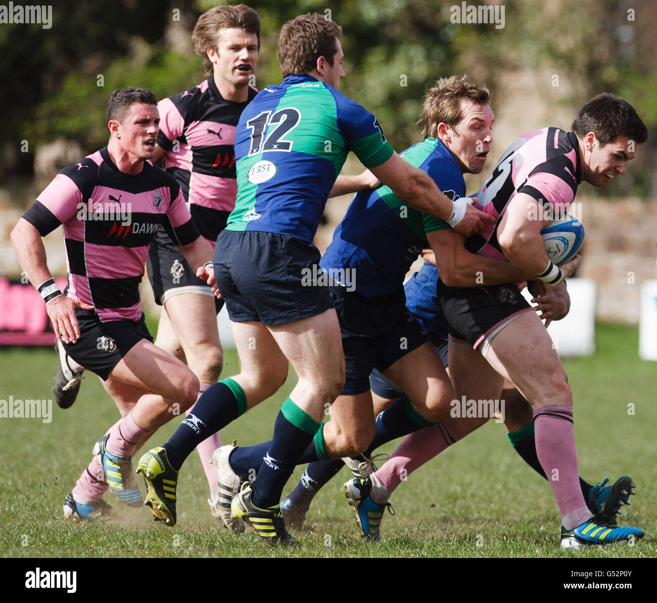 Ayr's Grant Anderson (right) is tackled by Boroughmuir's Malcolm Clapperton (left) during the RBS National Cup Semi-Final match at Millbrae, Ayr. Stock Photo