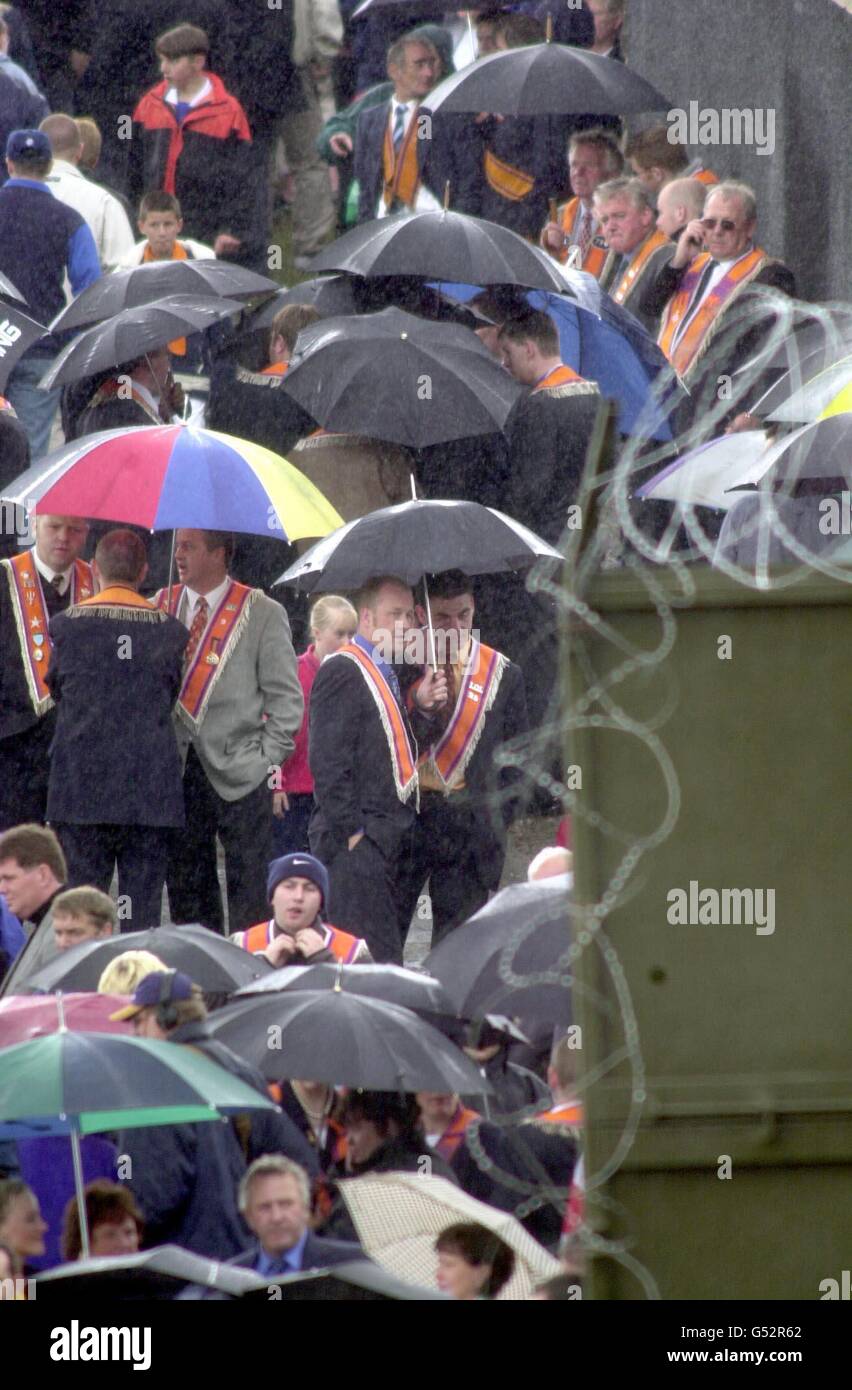 Orange Order members at the barrier in heavy rain as they assembled at the Security barrier, which prevented them from completing their March along the Garvaghy Road. Stock Photo