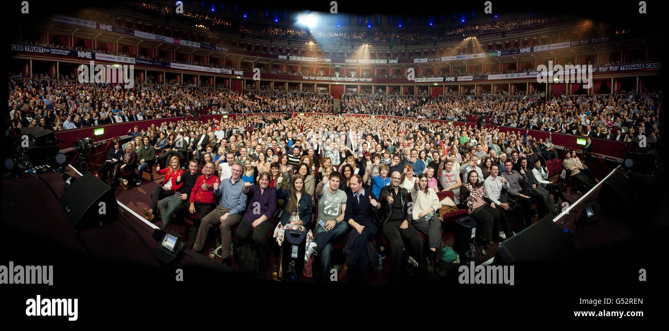 NOTE: THIS IMAGE IS MADE OF 5 SEPERATE IMAGES STITCHED TOGETHER. Panoramic image of the crowd, stitched from 5 separate images, pictured during the Teenage Cancer Trust Comedy Night, at the Royal Albert Hall in west London. Stock Photo