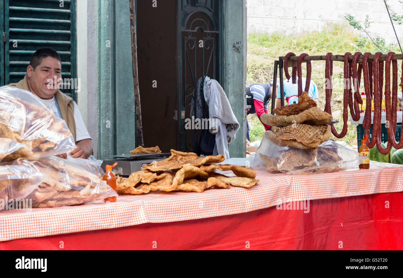 Mexican man making selling chicharrón, fried pork skin or cracklins at mercado or market in Jalpan de Serra, Queretaro, Mexico Stock Photo