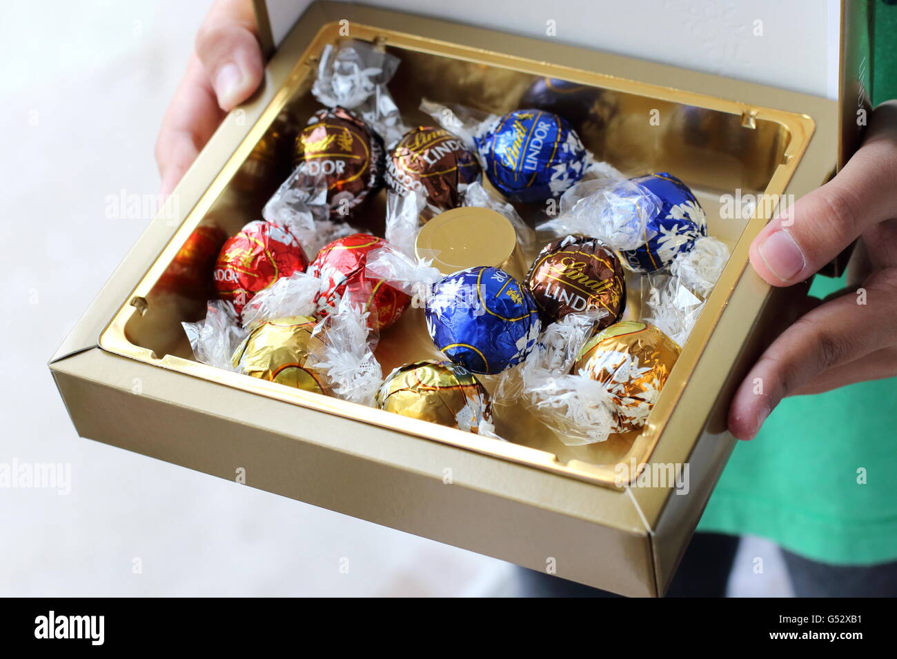 Close up of Assorted Lindt Lindor Chocolates in gold colour box Stock