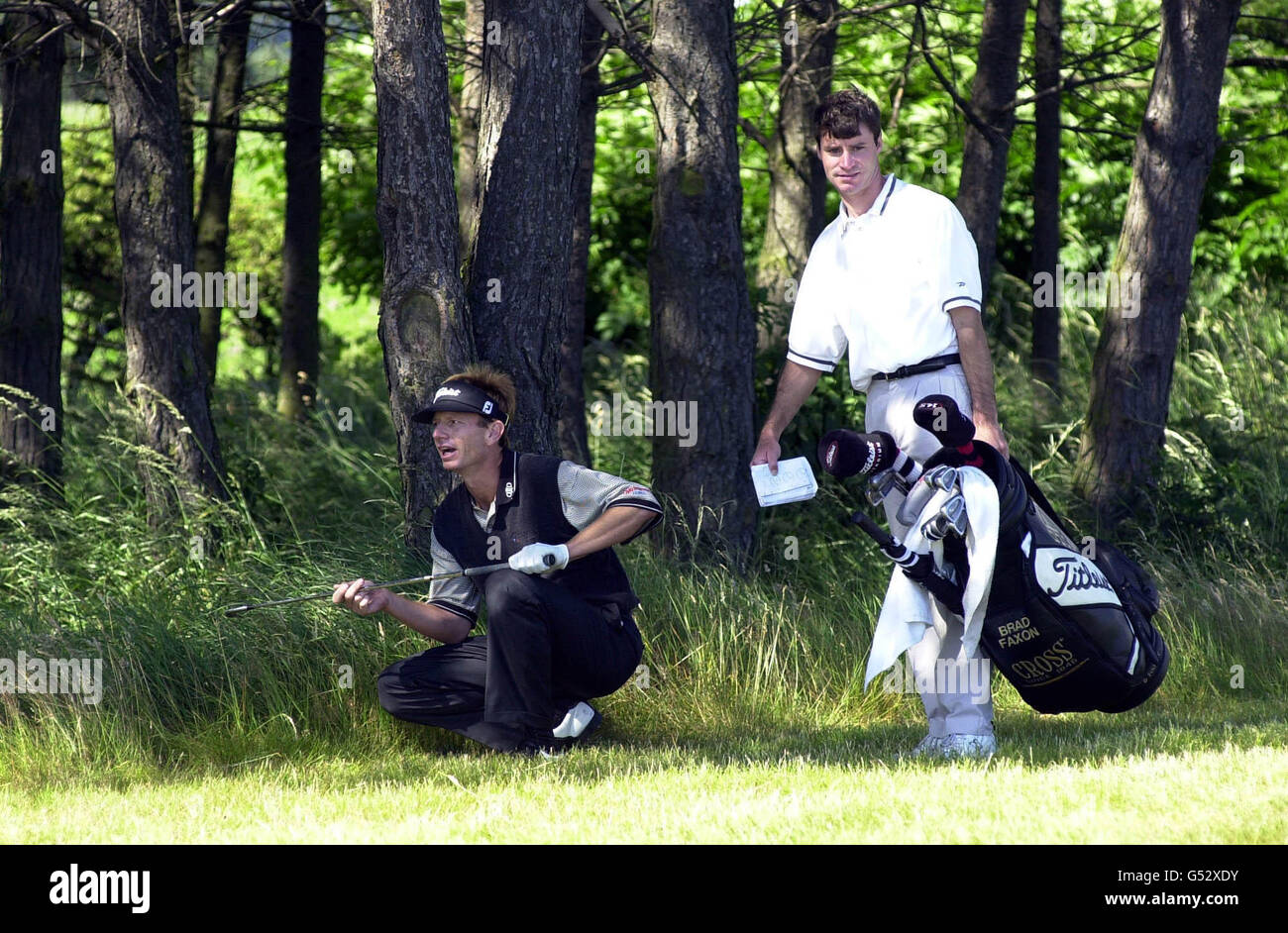 American Ryder Cup golfer Brad Faxon in the rough with his caddie at Lundin Golf Club, near St. Andrews, Scotland. Faxon is playing in the 129th Open Golf Tornament pre-qualifying competition. Stock Photo