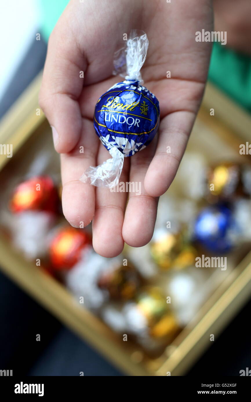 Close up of Assorted Lindt Lindor Chocolates in gold colour box Stock