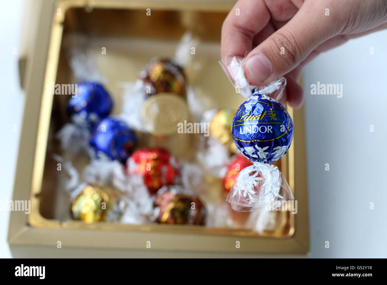 Close up of Assorted Lindt Lindor Chocolates in gold colour box Stock