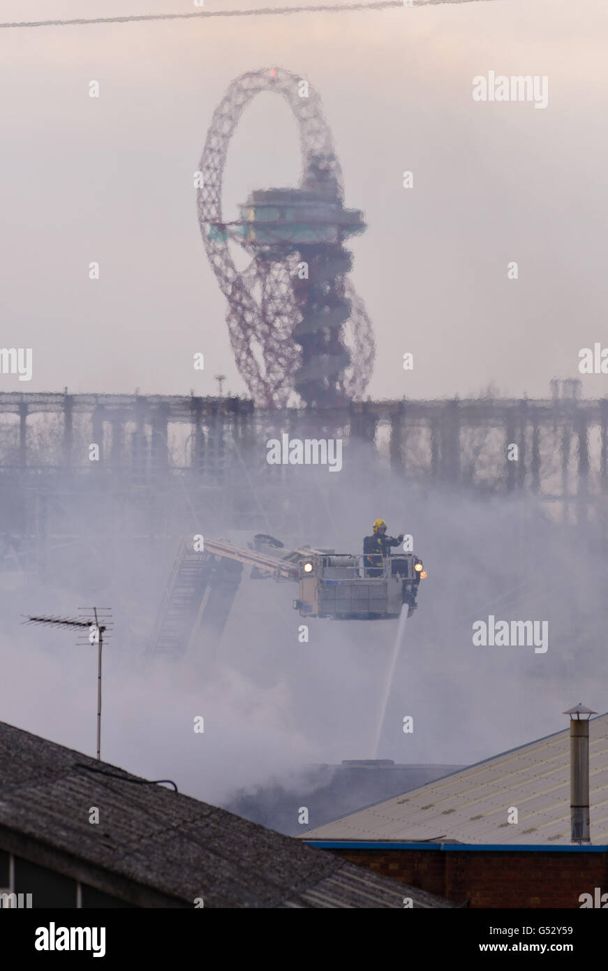 Firefighters at the scene of a fire in Canning Town, in east London. Stock Photo