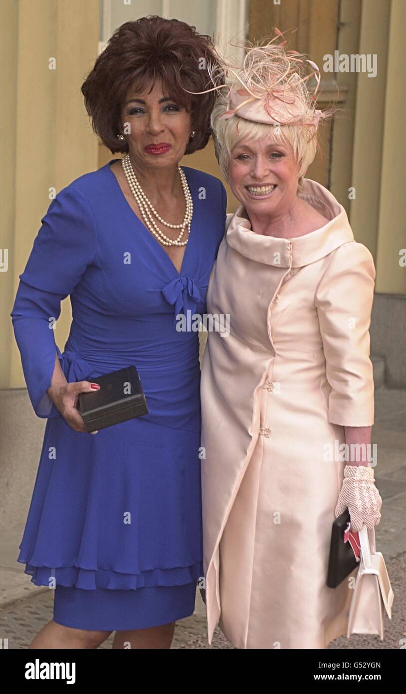 Welsh singer Dame Shirley Bassey (L) and actress Barbara Windsor, who received an MBE, during an investiture ceremony held at Buckingham Palace, in London, where they received their awards from Queen Elizabeth II. Stock Photo
