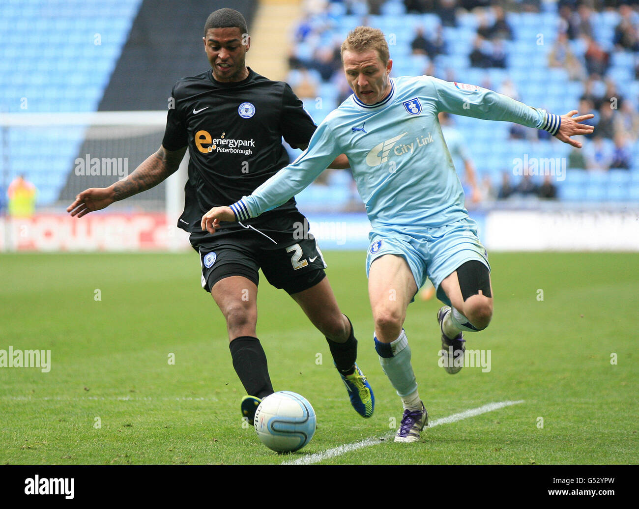 Coventry City's Gary McSheffrey and Peteborough United's Mark Little during the npower Football League Championship match at the Ricoh Arena, Coventry. PRESS ASSOCIATION Photo. Picture date: Saturday April 7, 2012. Photo credit should read:PA Wire. RESTRICTIONS. Maximum 45 images during a match. No video emulation or promotion as 'live'. No use in games, competitions, merchandise, betting or single club/player services. No use with unofficial audio, video, data, fixtures or club/league logos. Stock Photo