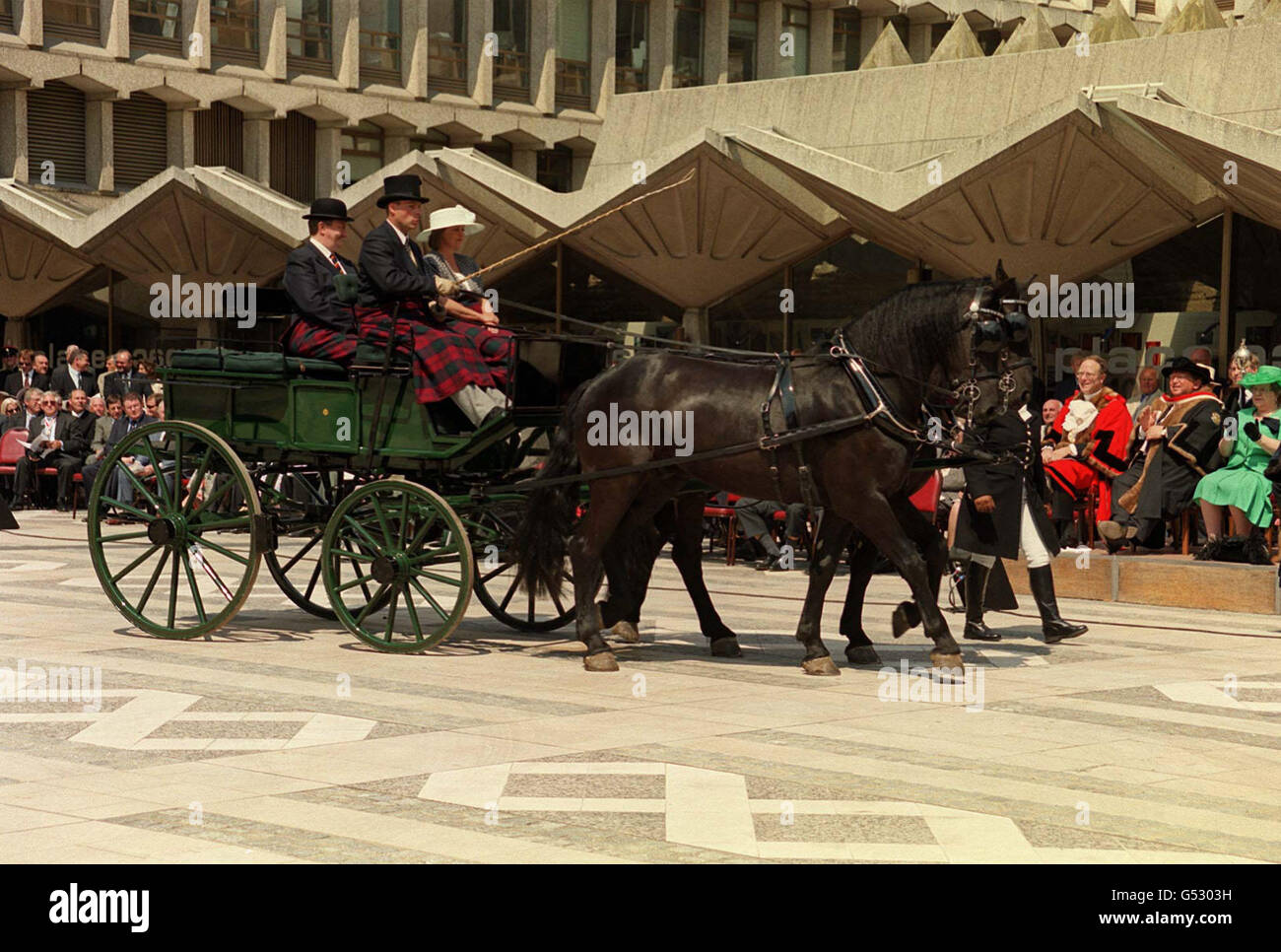 A horse-drawn carriage parading at the annual cart marking ceremony in Guildhall Yard, London. The 672nd Lord Mayor of the City of London, Alderman Clive Martin is embossing the City Arms and a year letter onto vehicles. Stock Photo