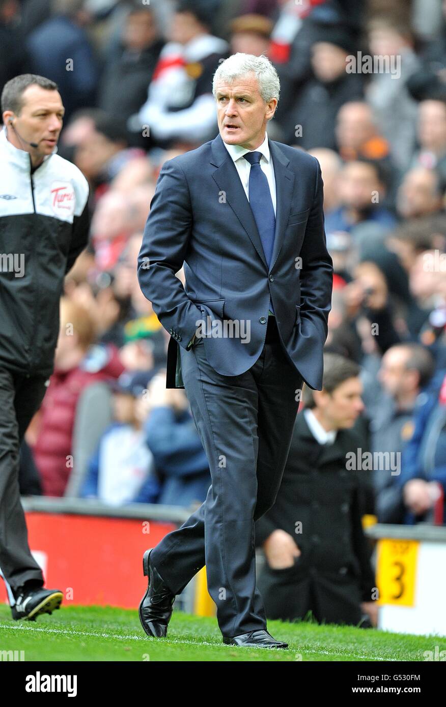 Soccer - Barclays Premier League - Manchester United v Queens Park Rangers - Old Trafford. Queens Park Rangers manager Mark Hughes looks towards the match officials as he walks off the pitch at half time Stock Photo