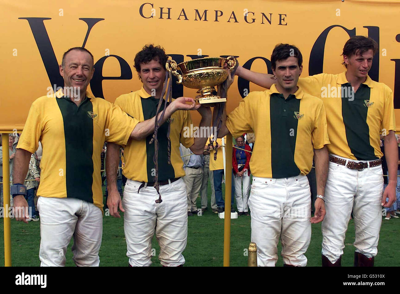 Geebung celebrate winning the Veuve Clicquot Gold Cup polo at Cowdray Park, near Midhurst, West Sussex. Geebung beat the Black Bears 13:8. Left to right Rick Stowe, Adolfo Cambiaso, Bautusta Heguy, Dave Allen. Stock Photo