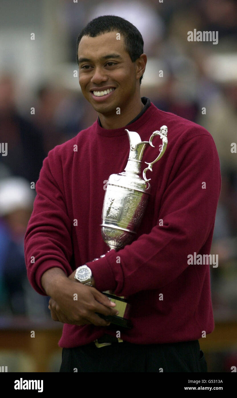 Tiger Woods clutches the Claret Jug after winning the Open golf