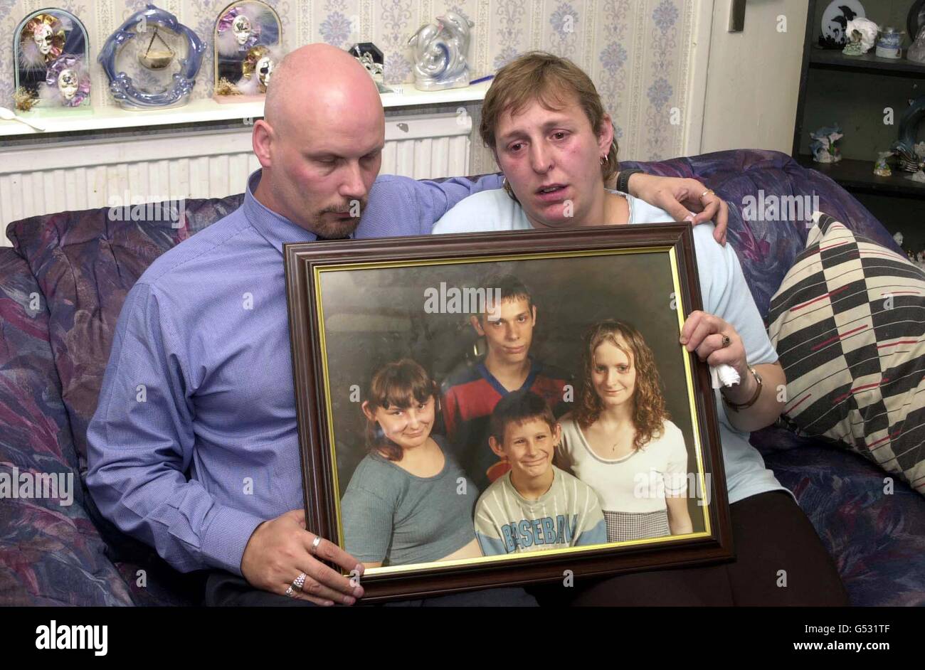 Child death holding family photograph landscape hires stock