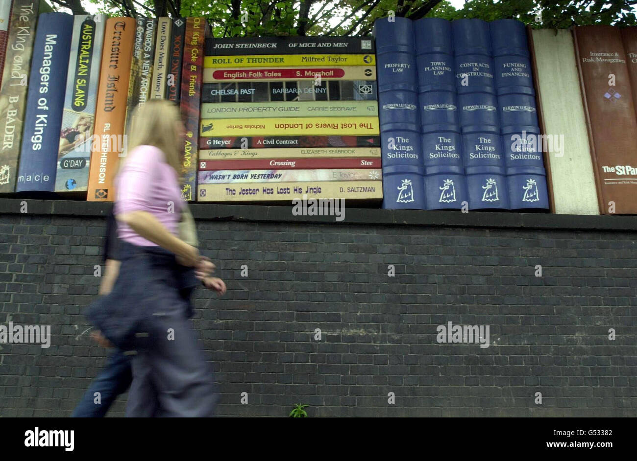 A hoarding which forms part of a series of giant books on the King's Road in Chelsea, central London. The temporary fence has been erected by developers in contrast to the usual painted hoardings to protect the site while it convertes to residential properties. Stock Photo