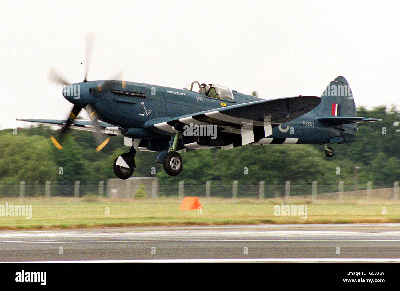 A Spitfire PR Mk XIX fighter plane coming in to land, at the Farnborough Air Show. Stock Photo