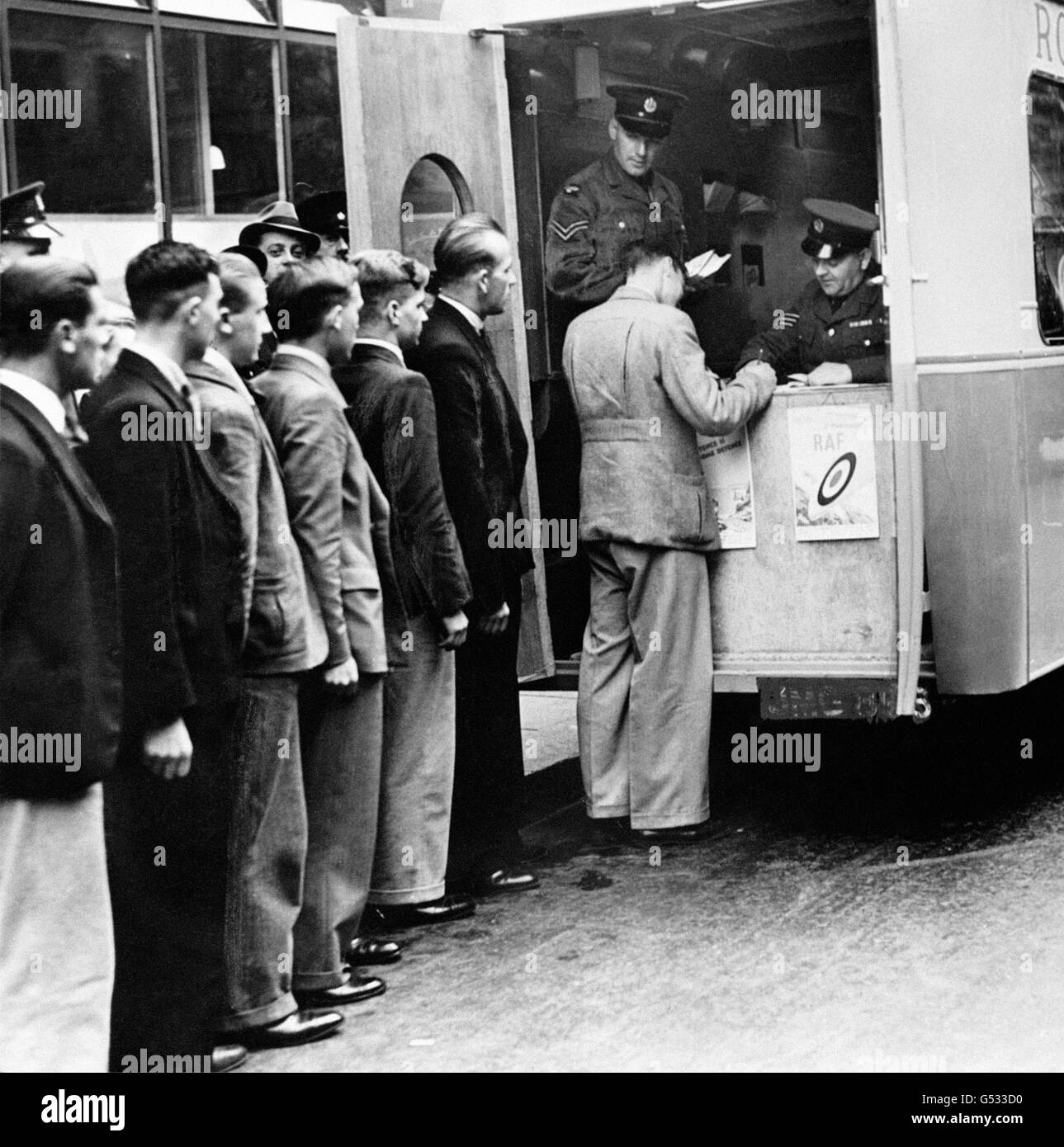 Potential recruits enlist at the first of ten mobile recruiting offices on duty outside Victory House in Kingsway, London, during the period when Britain prepared herself for the outbreak of the Second World War. Stock Photo