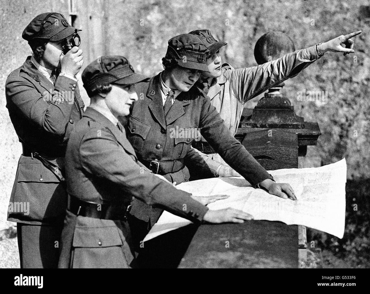 Members of the Women's Transport Service (Northern Ireland Section) taking compass bearings from the terrace of Killyleagh Castle, County Down, Northern Ireland. Stock Photo
