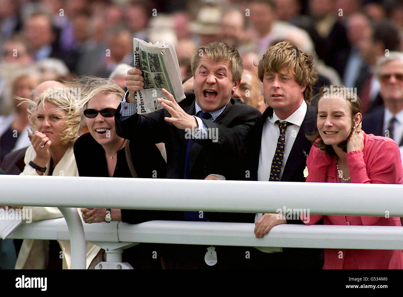 Racegoers cheer on their mounts at Glorious Goodwood, the second of five days festival racing at the West Sussex track. Stock Photo