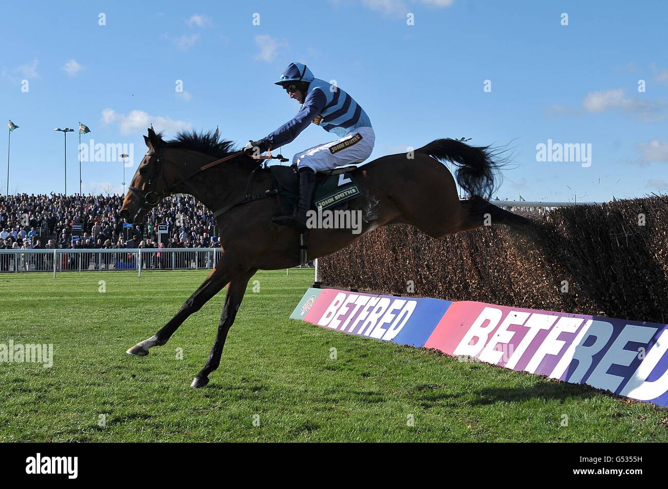 Cristal Bonus ridden by Daryl Jacob during the Betfred Manifesto Novices' Chase on Liverpool Day, at Aintree Racecourse Stock Photo