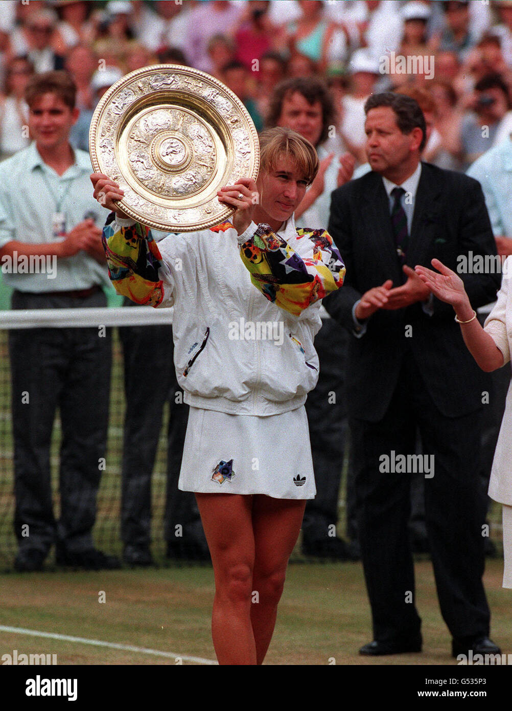 TEST PIC 3 Steffi Graf holds aloft the trophy after beating Jana ...