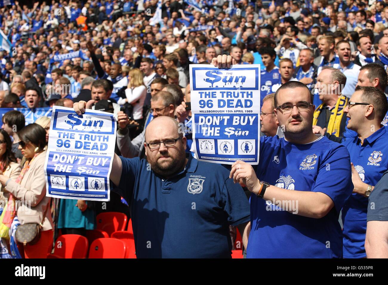 Soccer - FA Cup - Semi Final - Liverpool v Everton - Wembley Stadium. Everton fans hold up 'Don't buy the Sun' posters in the stands Stock Photo