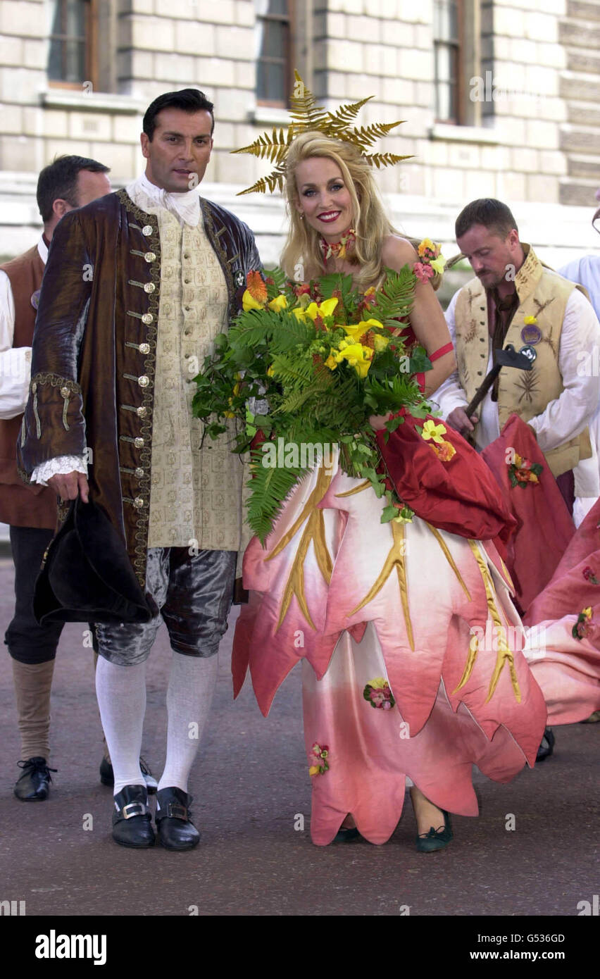 Philip Stanford accompanying actress Jerry Hall in the costume of Goddess Flora, arriving in Horseguards Parade to star in the National Trust tribute to The Queen Mother, the Trust's President. The pageant celebrates the Queen Mother's 100th birthday. Stock Photo