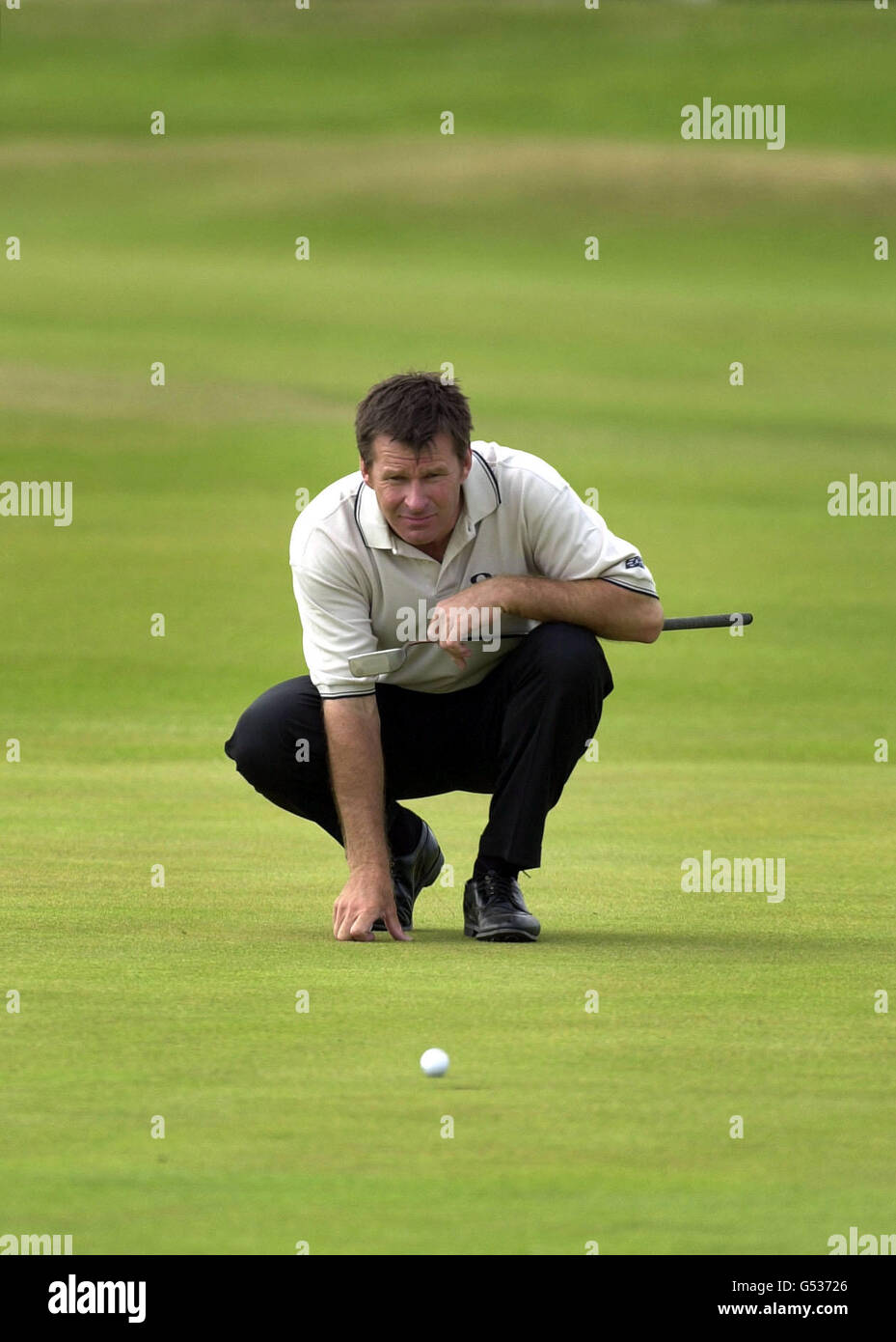 Open Golf St Andrews Faldo. England's Nick Faldo considers his putt on the 1st green at the Open Golf Championships at St Andrews, Scotland. Stock Photo