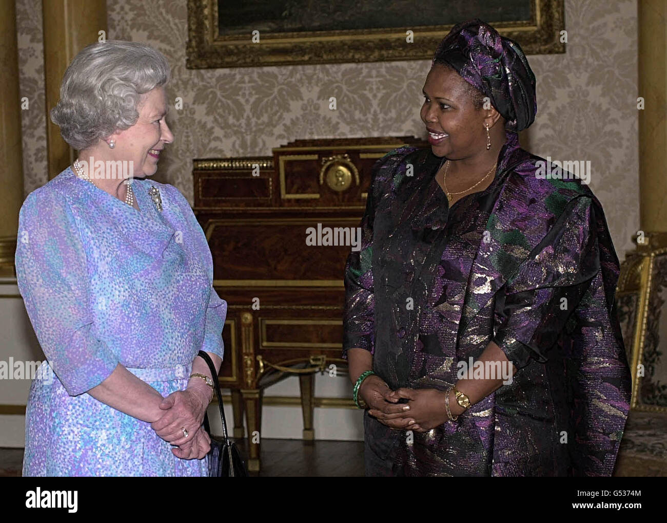 Queen Elizabeth II receives Her Excellency the High Commissioner for Kenya, Mrs Nancy Kiriu, during a reception held at Buckingham Palace, in London. Stock Photo