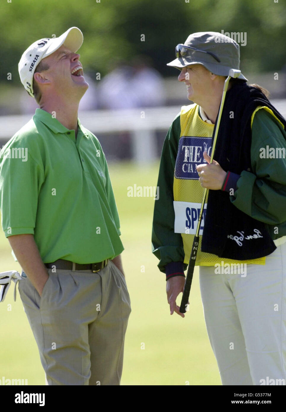 Britain's Jamie Spence shares a joke with his caddie during the 2000