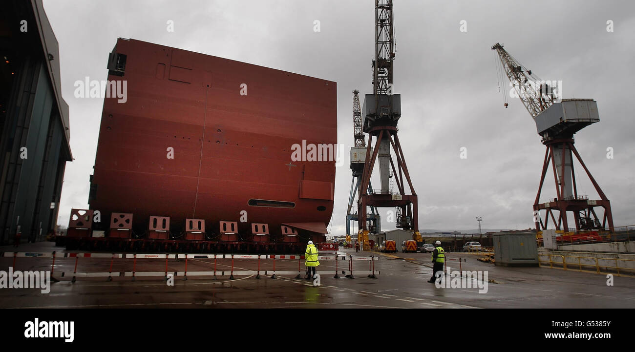 A section of the hull of HMS Queen Elizabeth is moved at BAE Systems' Govan Shipyard in Glasgow, Scotland. Stock Photo