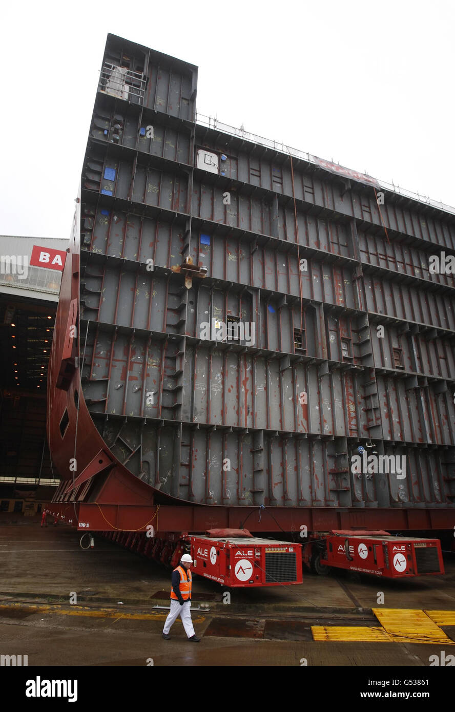 A section of the hull of HMS Queen Elizabeth is moved at BAE Systems' Govan Shipyard in Glasgow, Scotland. Stock Photo