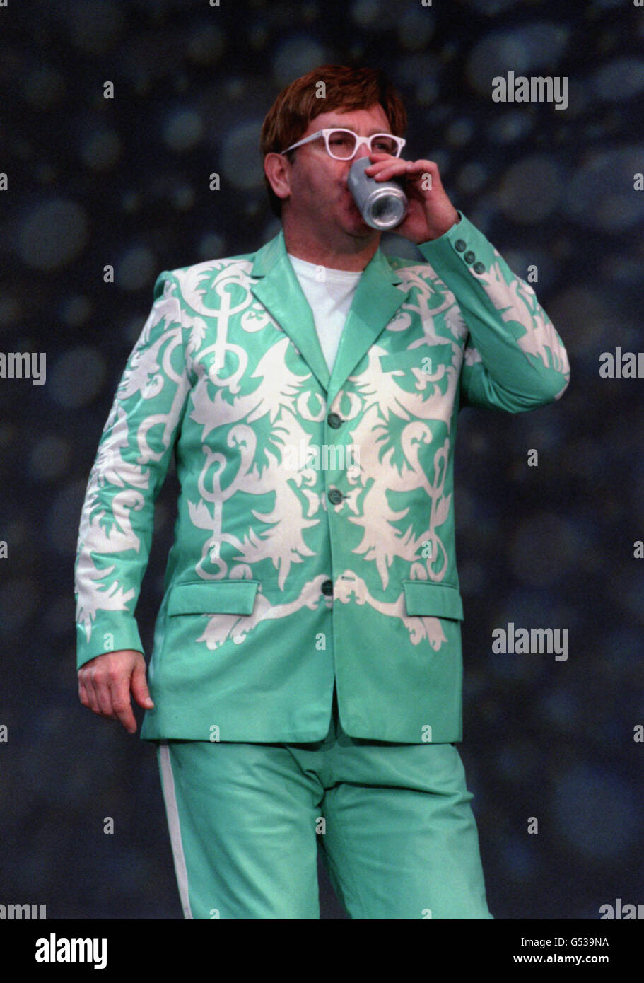 Sir Elton John taking a break from performing on stage, at the Route of Kings concert in Hyde Park, London. Stock Photo