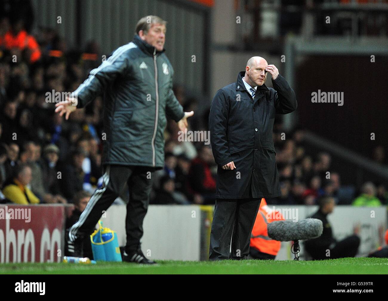 Soccer - Barclays Premier League - Blackburn Rovers v Liverpool - Ewood Park. Liverpool's manager Kenny Dalglish (left) and Blackburn Rovers' manager Steve Kean on the touchline Stock Photo