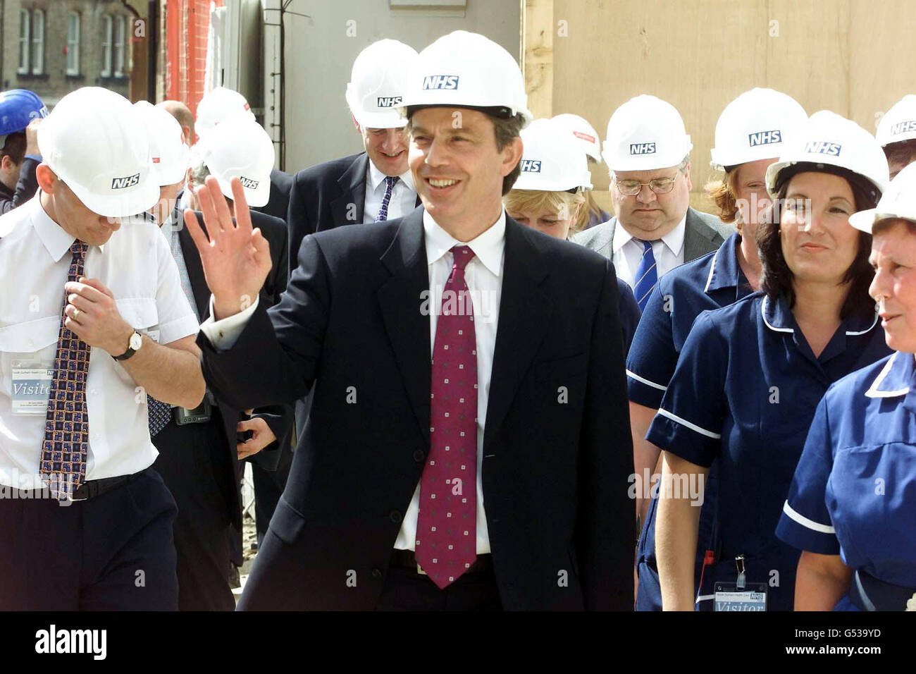 Smiling health politics hard hat arm raised waving tony blair hi-res