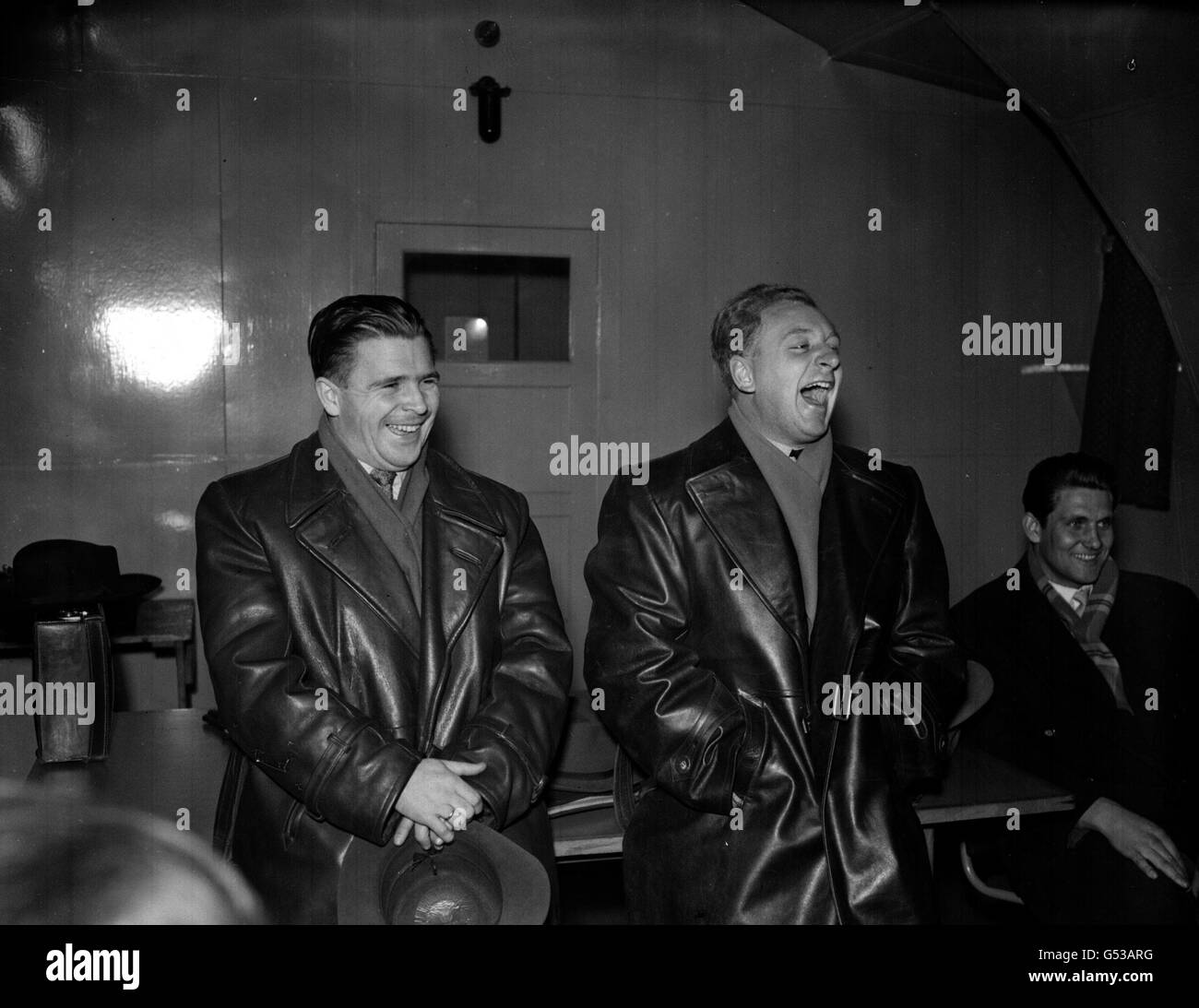 PA Photo 5/12/1954 Hearty laughter from Hungarian team members L. Puskas (left) and R. Hidas prior to their International friendly match against Scotland next Wednesday at Hampden Park arriving at Heathrow Airport, London by BEA Plane from Vienna Stock Photo