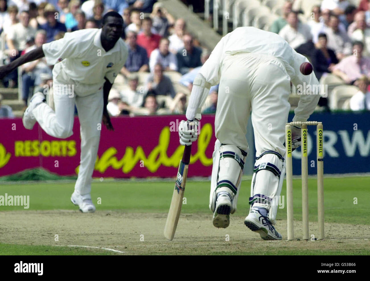 England batsman Dominic Cork stumbles as he faces a ball from West